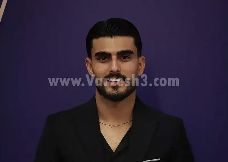 پیراهن سرخ بر تن برنده توپا چهارصد و چهار